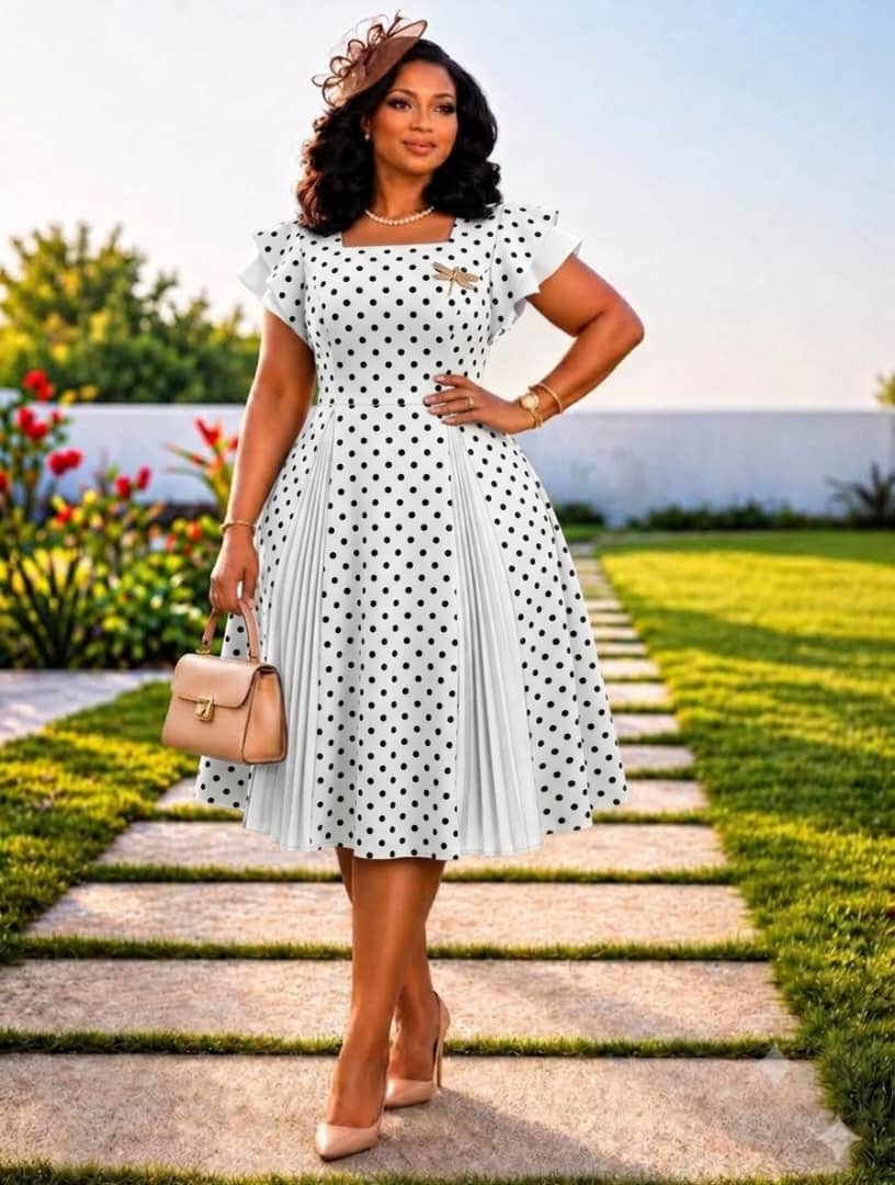 Polka dotted dress with pleated lower
